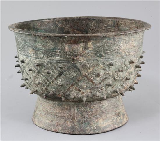 A Chinese archaic bronze ritual food vessel, Yu, Shang dynasty, Anyang type, 17cm high, 25.5cm diameter, crack